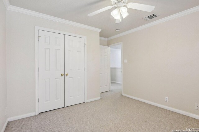 24434 Brazos Stage, San Antonio, TX 78255 - unfurnished bedroom with carpet, ornamental molding, baseboards, a closet, and a ceiling fan