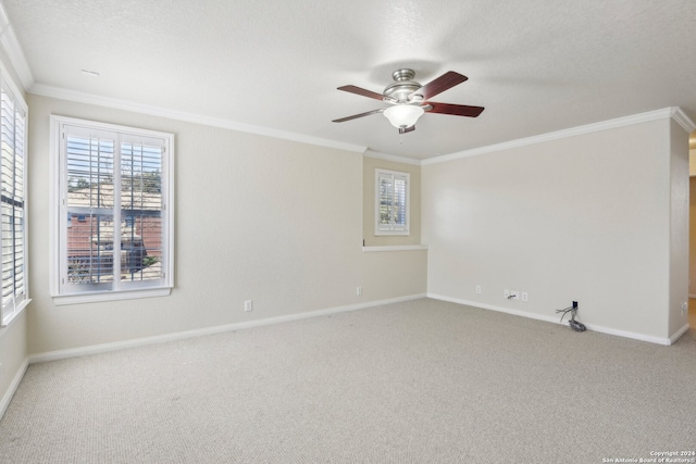 carpeted empty room with a textured ceiling, ceiling fan, and crown molding