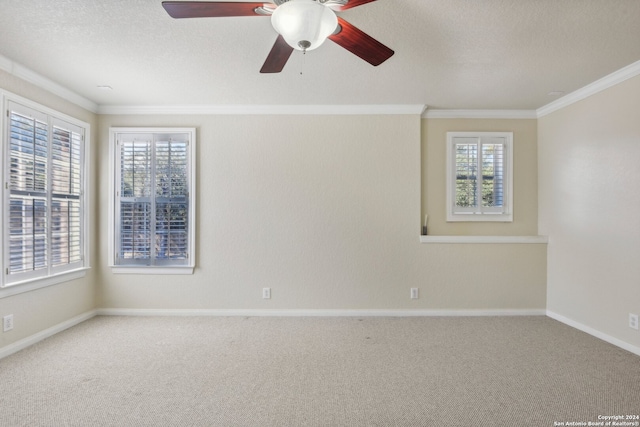 unfurnished room featuring a textured ceiling, carpet flooring, ceiling fan, and crown molding