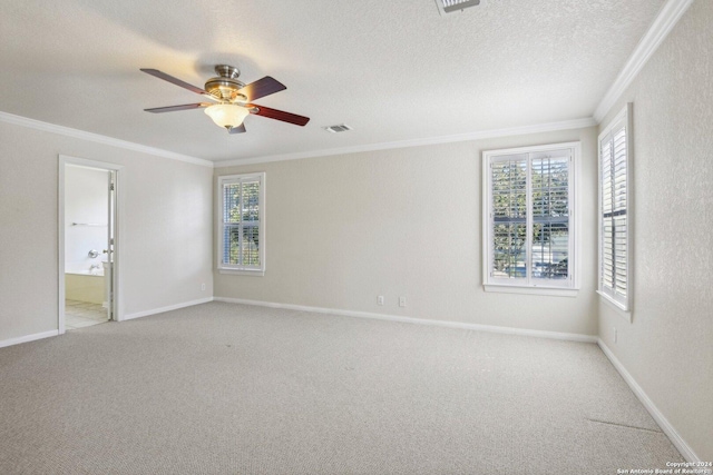 24434 Brazos Stage, San Antonio, TX 78255 - empty room featuring crown molding, healthy amount of natural light, carpet flooring, a ceiling fan, and baseboards