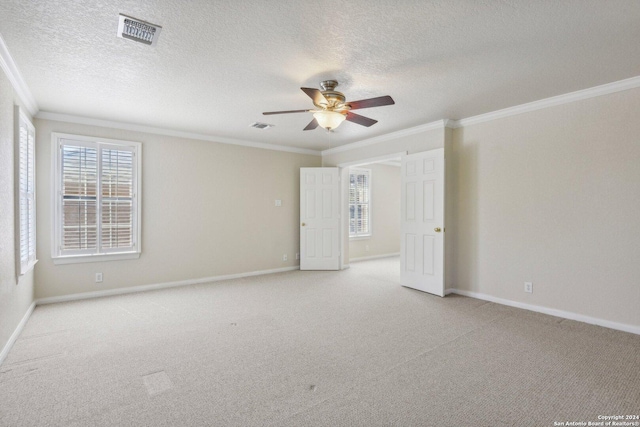 24434 Brazos Stage, San Antonio, TX 78255 - unfurnished room featuring ornamental molding, a ceiling fan, healthy amount of natural light, light colored carpet, and a textured ceiling
