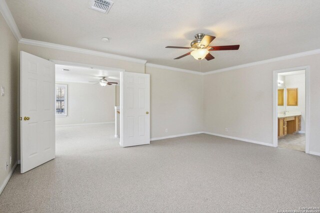 24434 Brazos Stage, San Antonio, TX 78255 - empty room with a ceiling fan, light colored carpet, baseboards, and crown molding