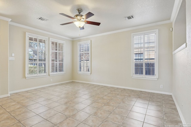 tiled spare room featuring ornamental molding, a textured ceiling, and ceiling fan