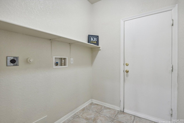 24434 Brazos Stage, San Antonio, TX 78255 - laundry area featuring electric dryer hookup, hookup for a washing machine, light tile patterned flooring, and baseboards