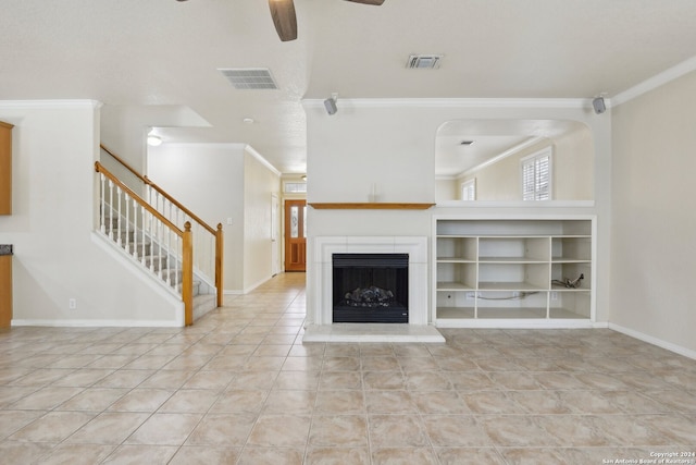 unfurnished living room with ceiling fan, crown molding, and light tile patterned floors