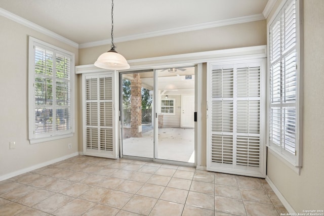 unfurnished dining area featuring ornamental molding and light tile patterned flooring