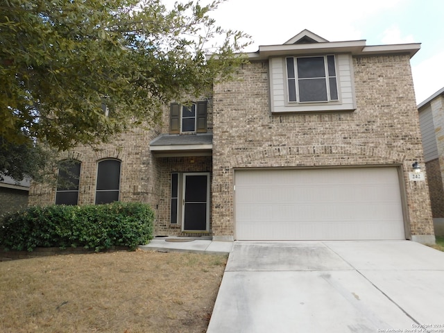 view of front of property with a garage