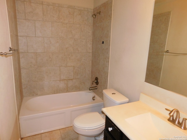 full bathroom featuring tile patterned flooring, vanity, toilet, and tiled shower / bath