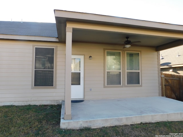 doorway to property featuring ceiling fan and a patio area