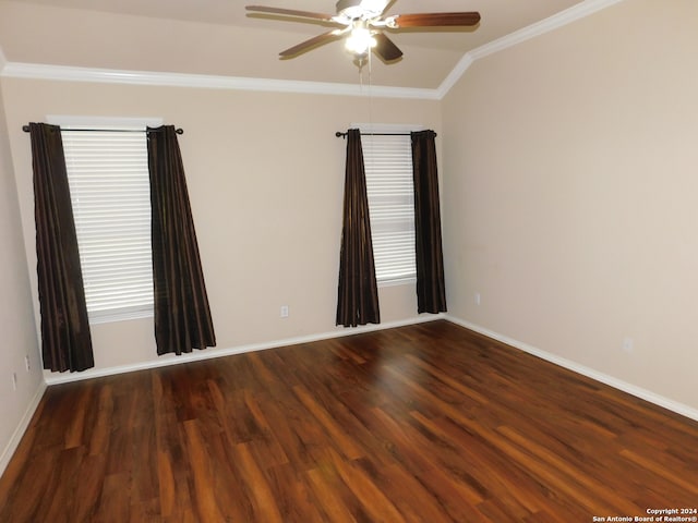 spare room with dark hardwood / wood-style floors, ceiling fan, ornamental molding, and vaulted ceiling