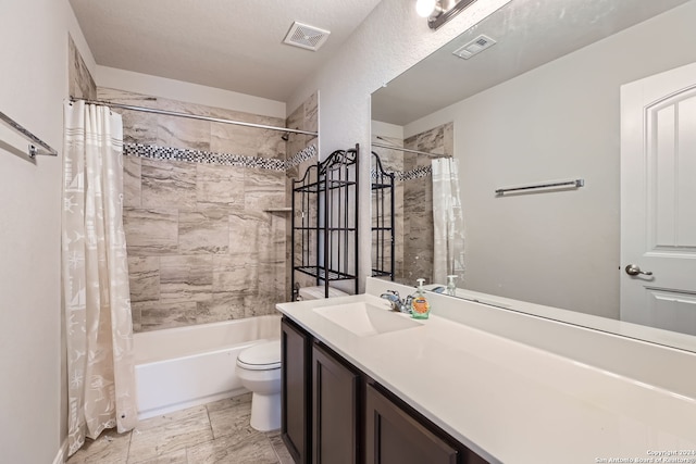 full bathroom featuring a textured ceiling, vanity, toilet, and shower / bathtub combination with curtain