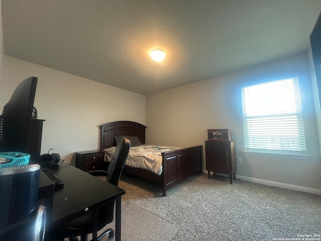 bedroom with light colored carpet