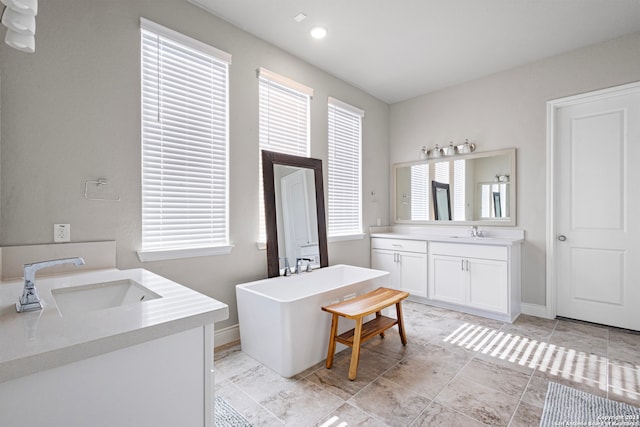 bathroom featuring a bath and vanity