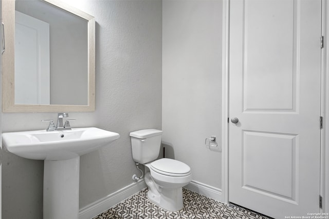 bathroom with sink and toilet