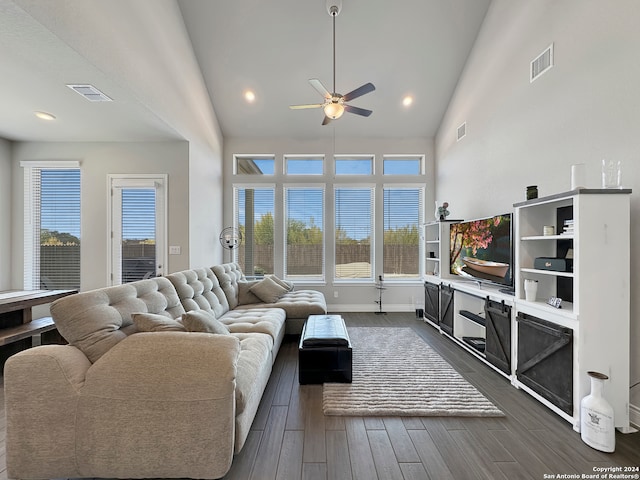 living room with high vaulted ceiling, dark hardwood / wood-style flooring, and ceiling fan