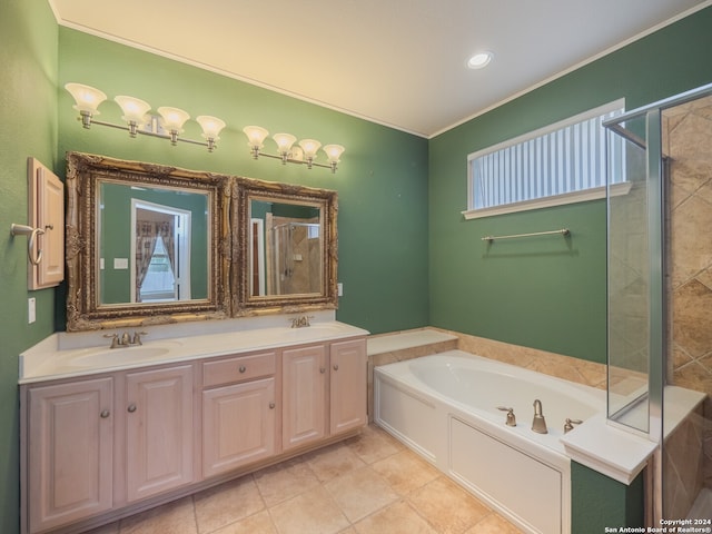 bathroom with tile patterned flooring, shower with separate bathtub, and vanity