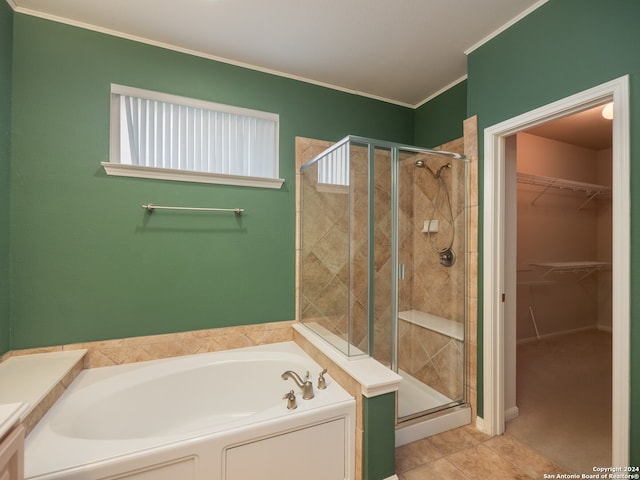 bathroom featuring tile patterned floors, separate shower and tub, and ornamental molding