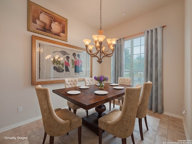 dining area with light tile patterned flooring and a notable chandelier