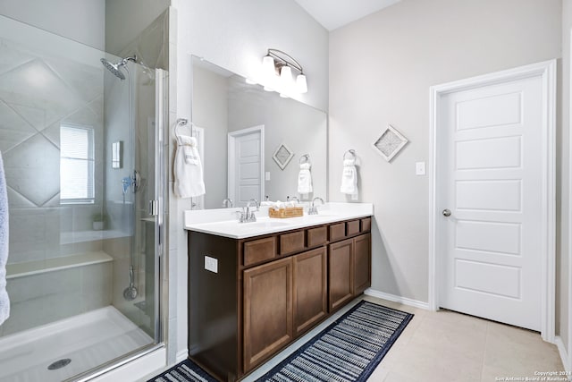 bathroom featuring vanity, walk in shower, and tile patterned flooring