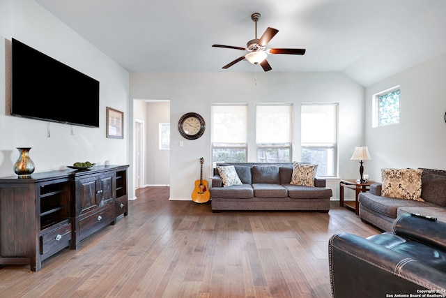 living room with vaulted ceiling, ceiling fan, and light hardwood / wood-style flooring