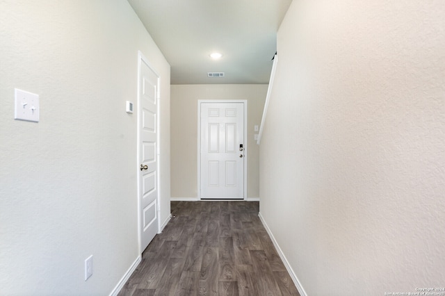 hallway featuring dark wood-type flooring