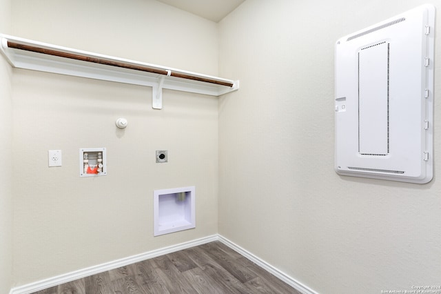 clothes washing area featuring gas dryer hookup, washer hookup, dark hardwood / wood-style floors, and hookup for an electric dryer