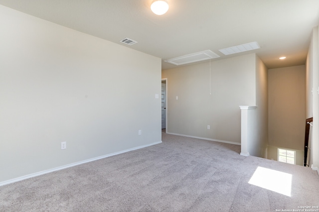 empty room featuring light colored carpet