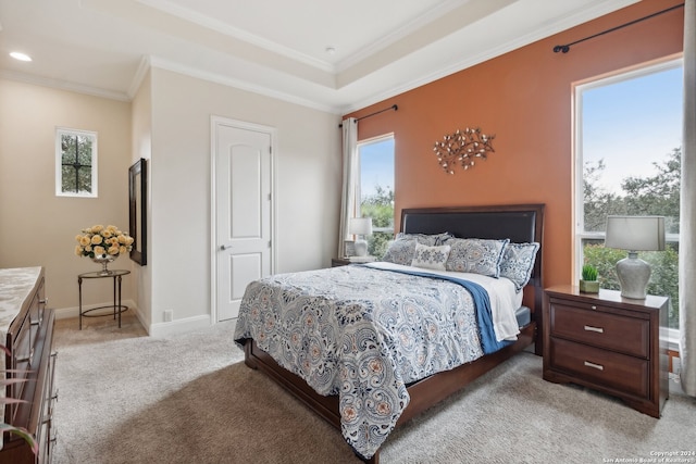 carpeted bedroom featuring crown molding