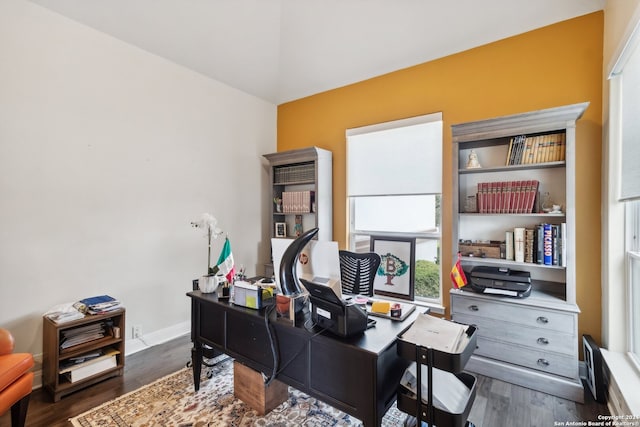 home office with dark hardwood / wood-style flooring