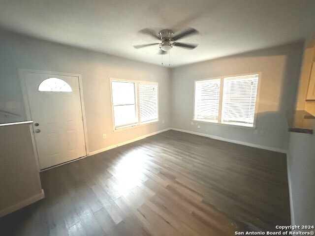 entrance foyer with dark hardwood / wood-style flooring and ceiling fan