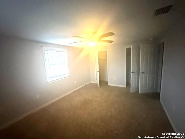 unfurnished bedroom featuring carpet