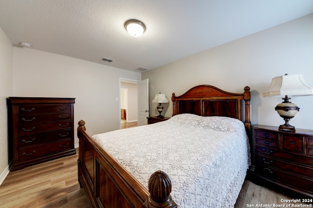 bedroom featuring light hardwood / wood-style flooring