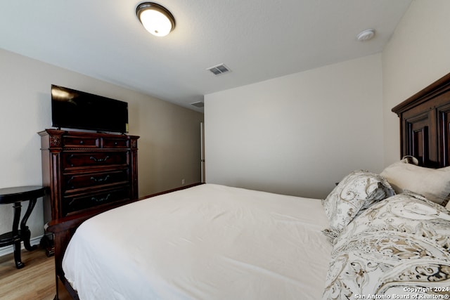 bedroom with light hardwood / wood-style flooring