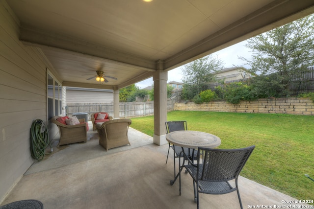 view of patio with outdoor lounge area and ceiling fan