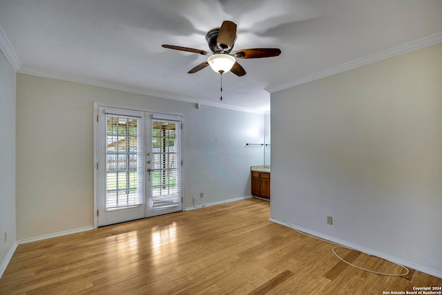 empty room featuring french doors, light hardwood / wood-style flooring, ceiling fan, and crown molding