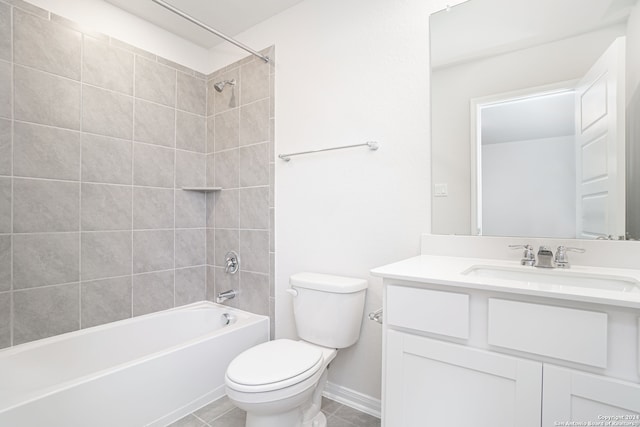 full bathroom featuring tile patterned floors, vanity, toilet, and tiled shower / bath