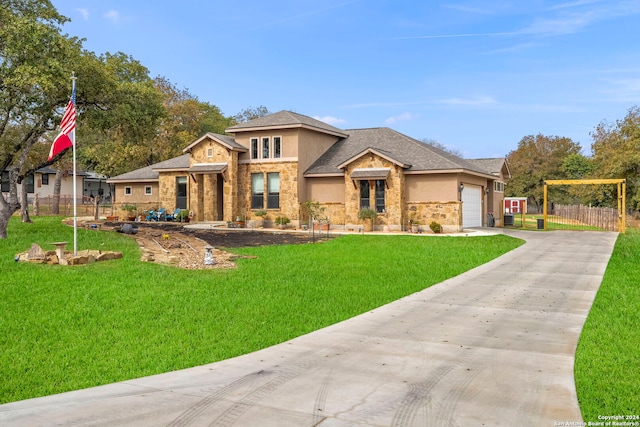 view of front of property with a front lawn and a garage