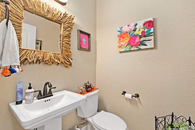 bathroom with sink and toilet