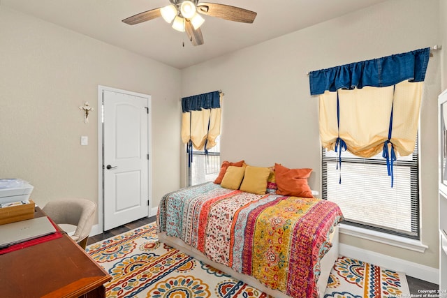 bedroom with hardwood / wood-style floors and ceiling fan