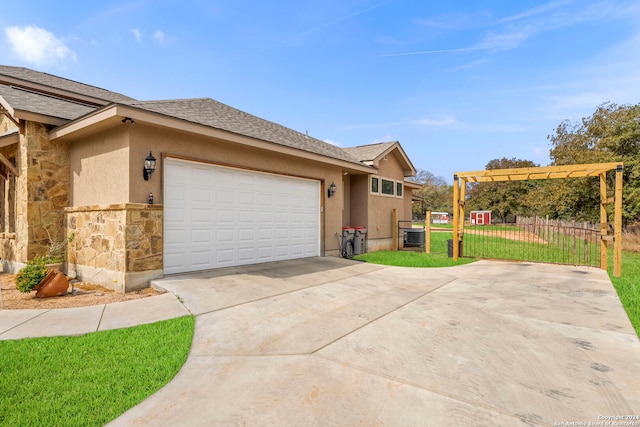 view of front of home featuring a garage and a front lawn