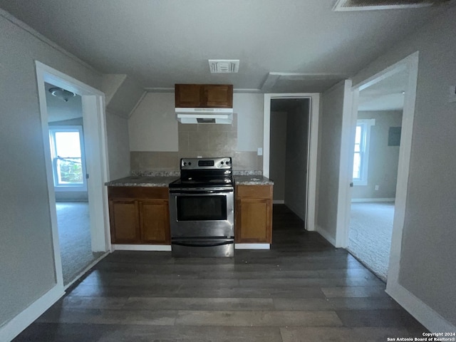 kitchen featuring dark hardwood / wood-style flooring, tasteful backsplash, electric stove, and lofted ceiling