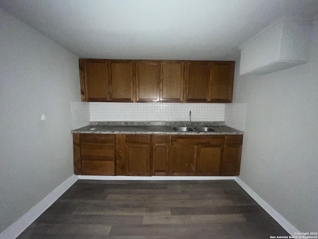 118 Odis, San Antonio, TX 78204 - kitchen with a sink, baseboards, brown cabinetry, and tasteful backsplash