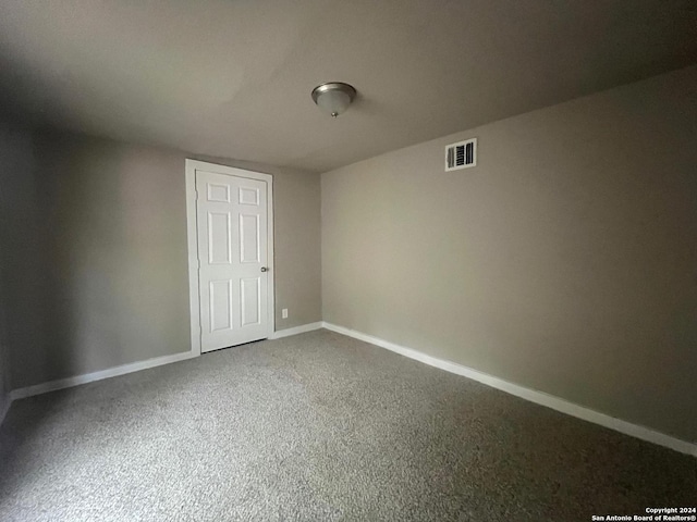 118 Odis, San Antonio, TX 78204 - unfurnished bedroom featuring baseboards and carpet
