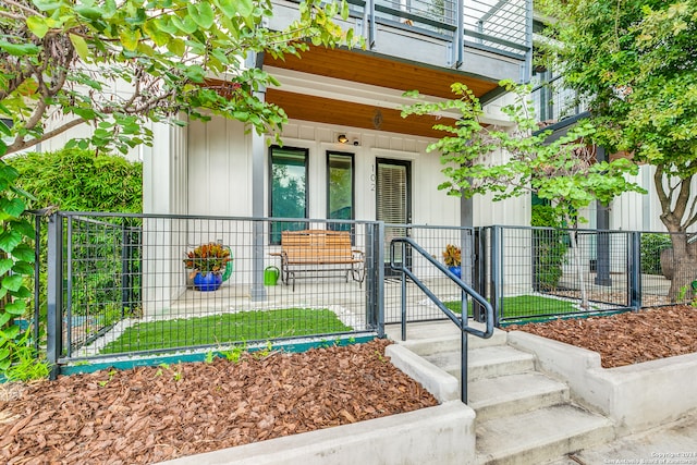 entrance to property featuring a balcony