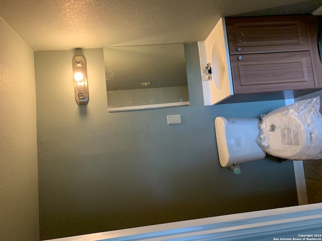 7007 Calle Aleman, San Antonio, TX 78252 - room details featuring a textured ceiling