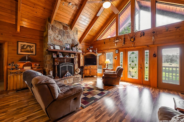 living room with a wealth of natural light, high vaulted ceiling, wooden ceiling, and dark hardwood / wood-style floors