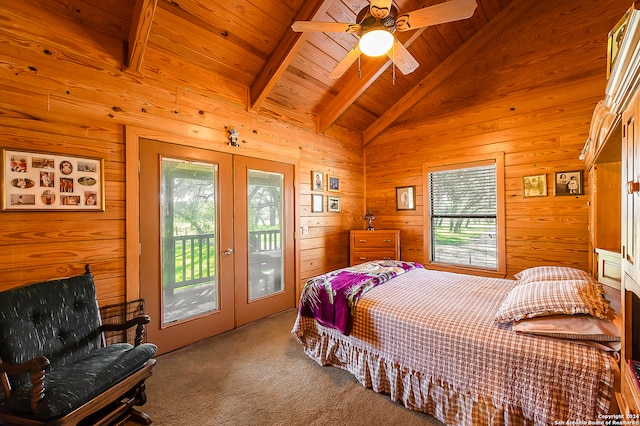 carpeted bedroom featuring access to outside, multiple windows, french doors, and beam ceiling