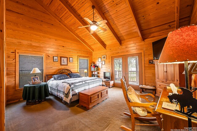 bedroom featuring ceiling fan, french doors, wooden ceiling, carpet floors, and wooden walls