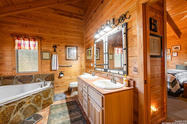 bathroom featuring vaulted ceiling with beams, plenty of natural light, and wooden walls