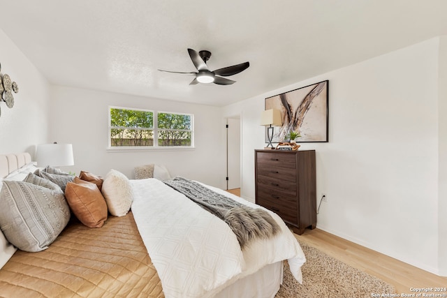 bedroom featuring ceiling fan and light wood-type flooring